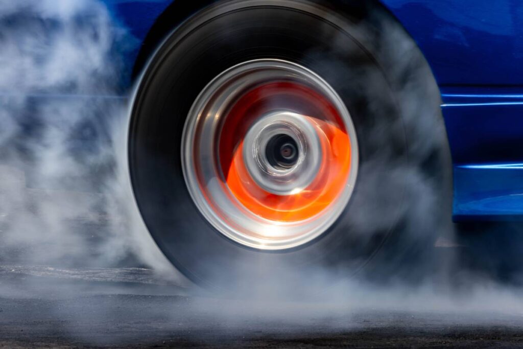 car burnout wheels tire with white smoke car wheel 2024 02 08 15 24 57 utc 1