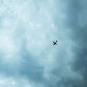 low angle shot of a plane in the blue cloudy sky 2023 11 27 05 00 44 utc 1