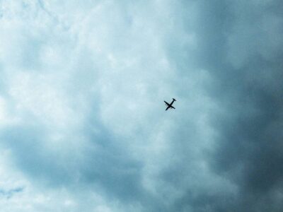 low angle shot of a plane in the blue cloudy sky 2023 11 27 05 00 44 utc 1