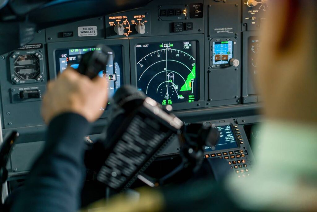 pilot in airplane cockpit holding turning wheel ru 2023 12 22 20 31 31 utc 1