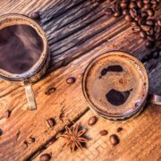 closeup of hot coffee in old wooden table 2023 11 27 05 12 20 utc 1