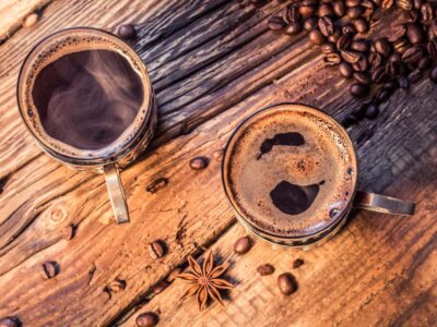 closeup of hot coffee in old wooden table 2023 11 27 05 12 20 utc 1