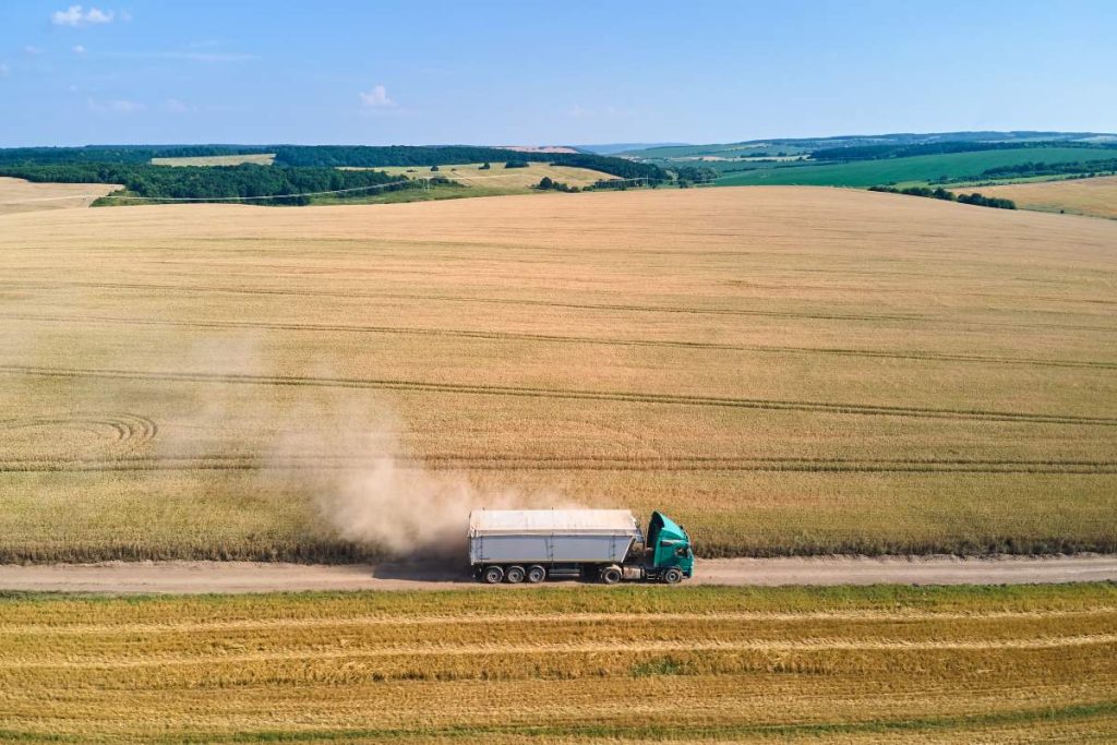 aerial view of lorry cargo truck driving on dirt r 2023 11 27 04 55 11 utc 1